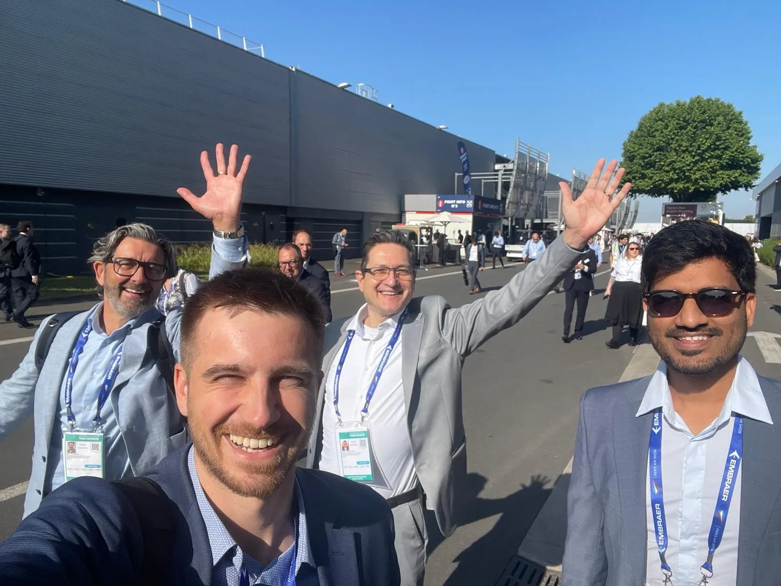 Team selfie outside the exhibition halls at the Paris Air Show, June 2025.