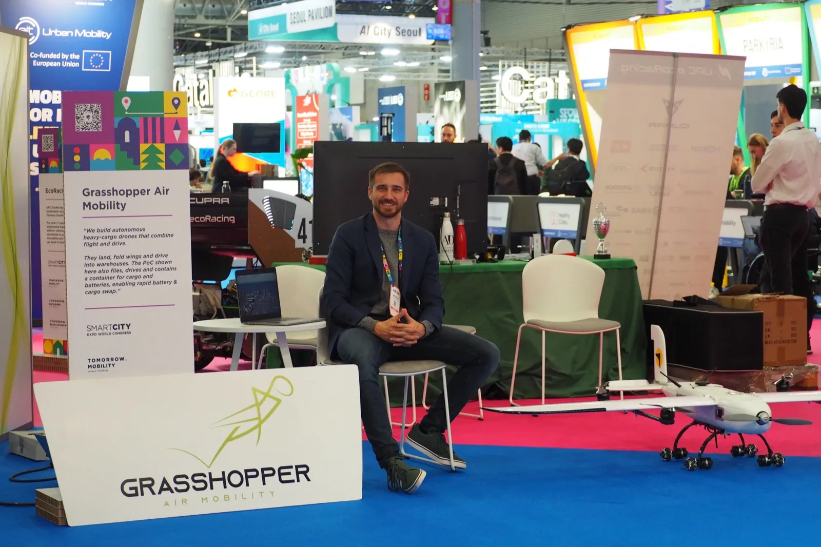 Jakob at the Grasshopper stand at the Smart City Expo World Congress, next to the proof-of-concept drone, November 2025.